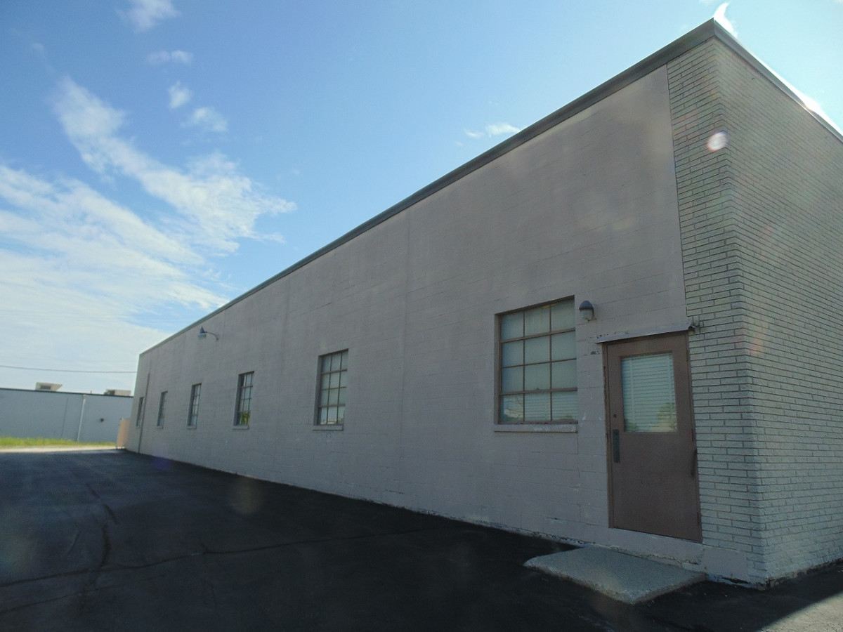 Repaint commercial building pioneer warehouse in menomonee falls wi